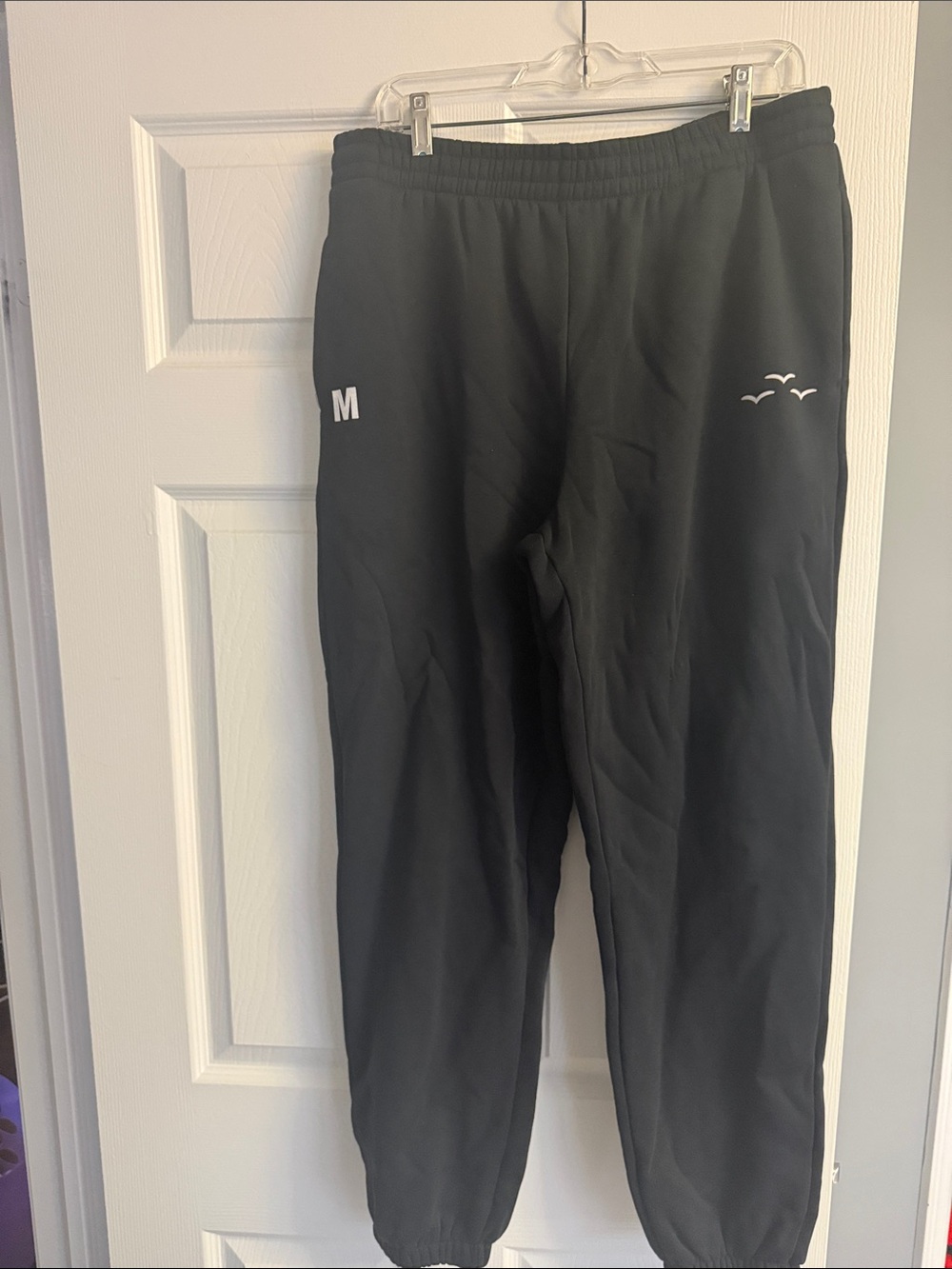 Black Lazy Pants Sweatpants with Elastic Waistband and an M on them